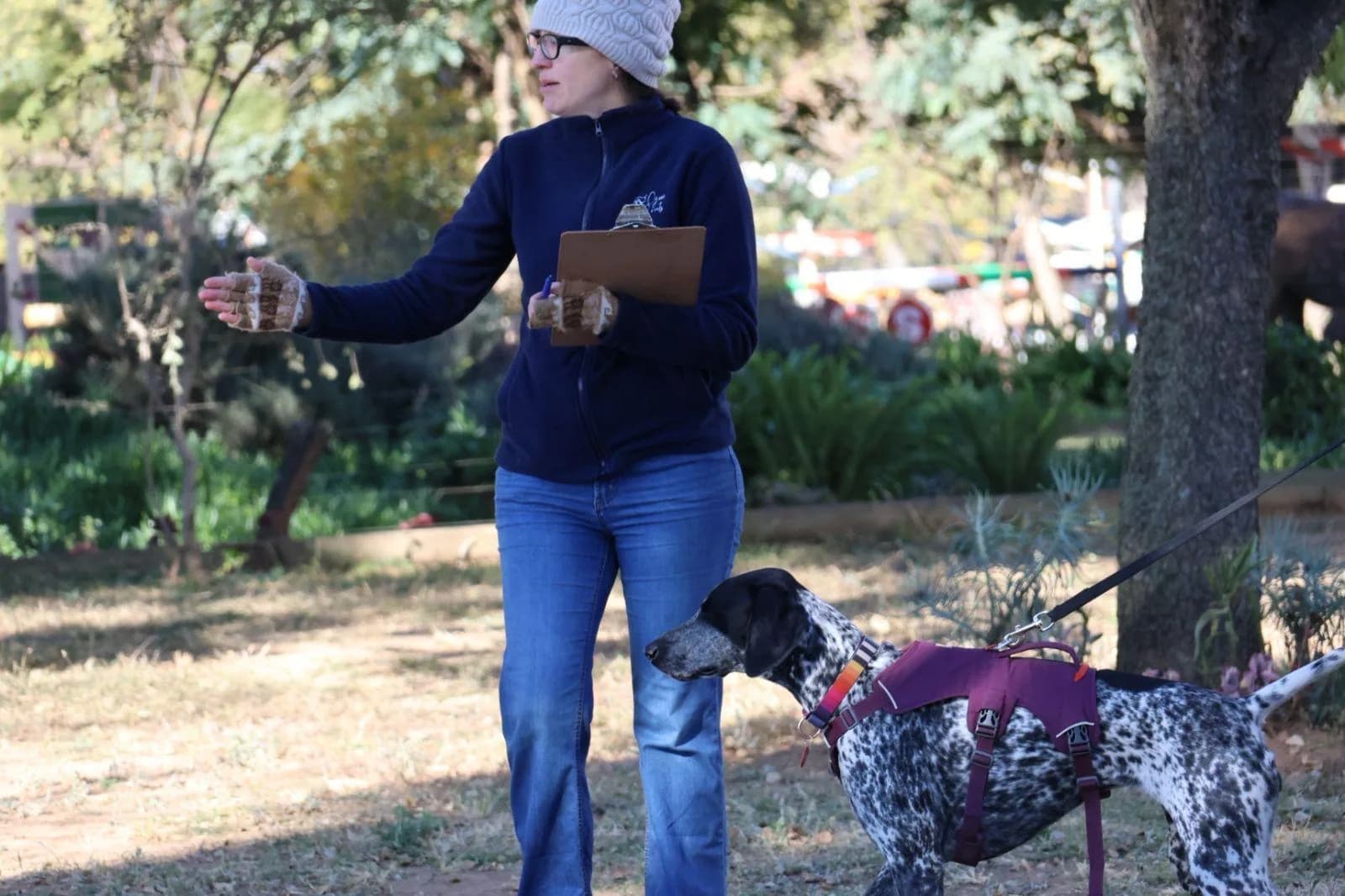 A CNASA official briefs a handler and dog before a search
